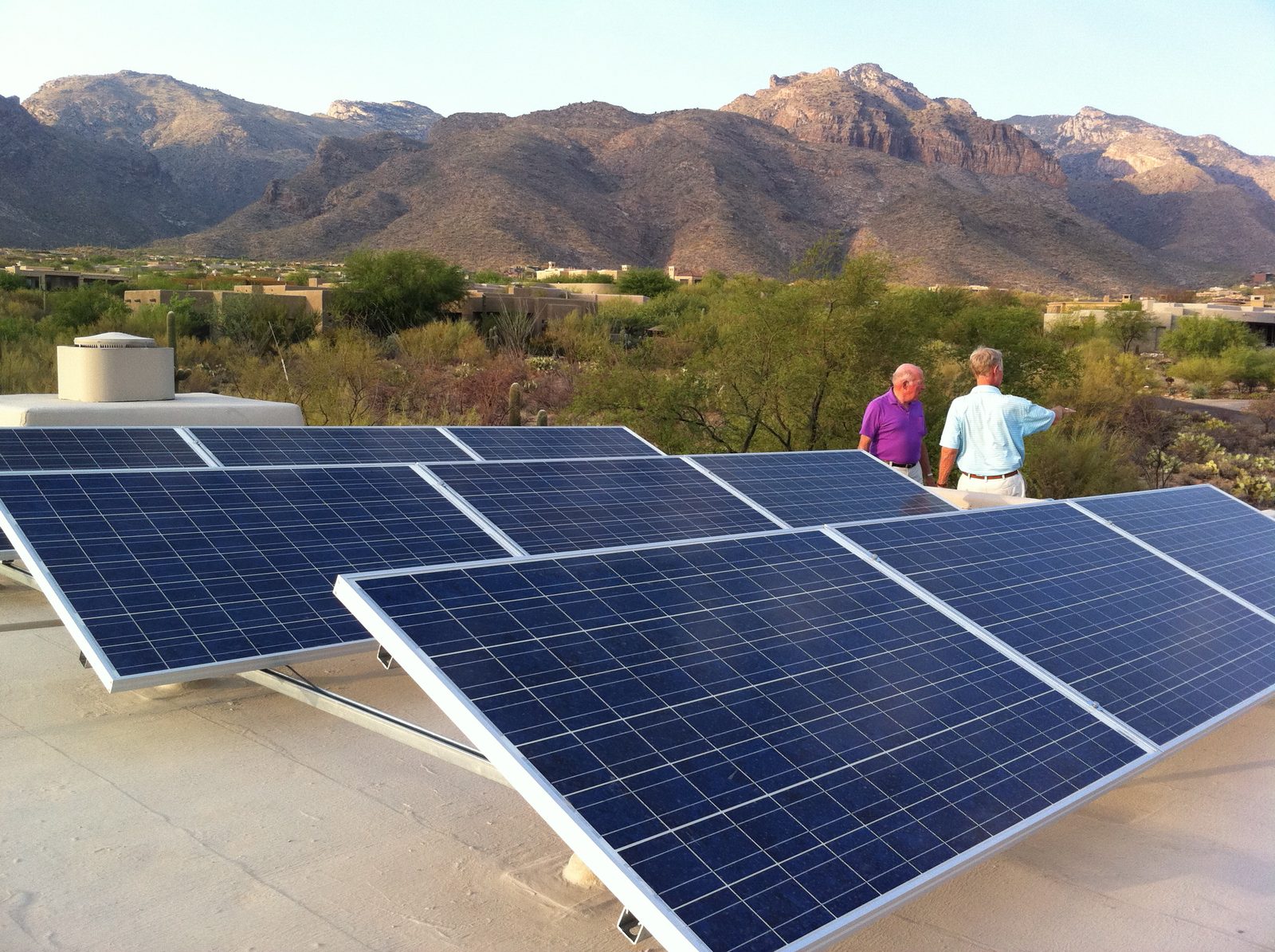 Dad and neighbor Stuart on the roof for a tour of the solar panel installation. 