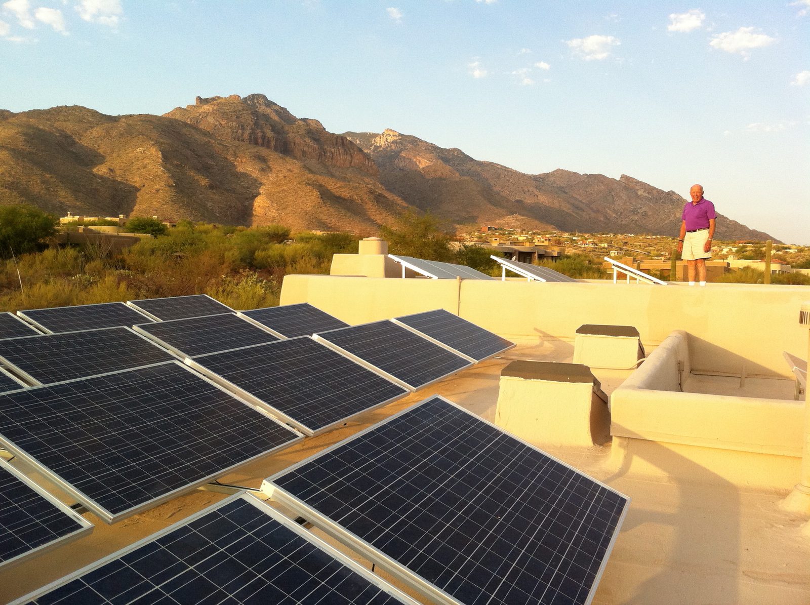 Dad on the roof with his 8 kilowatt solar panel system