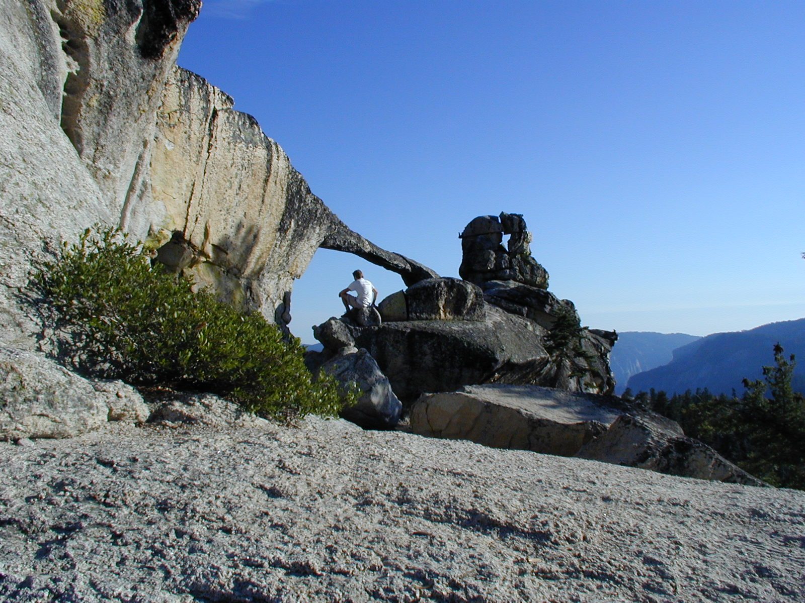 John, thinking deep thoughts, peering through Yosemite's only natural land bridge, Indian Rock.