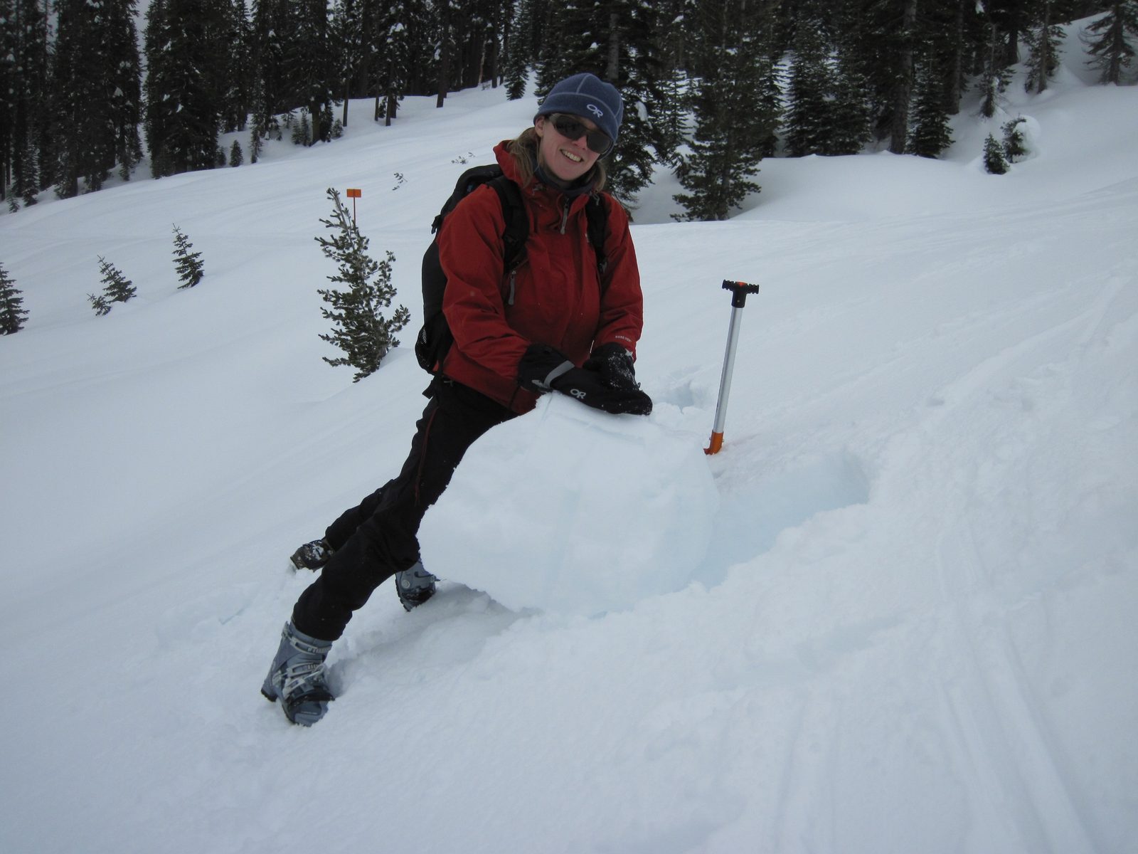 Mara, one of my classmates, and the only other telemarker digs a pit to examine snow layers.