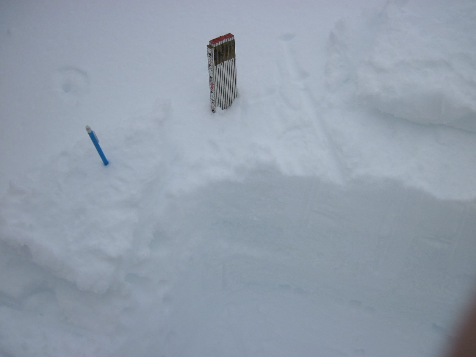 John's snow pit, with pencil (for testing snow hardness) and ruler.