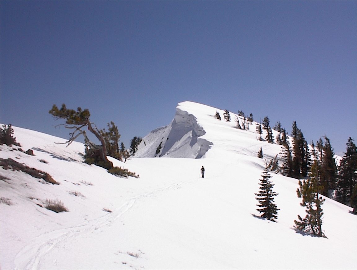 Rachel, just north of Alpine Meadows, with an impressive cornice in the background.  (Hopefully...