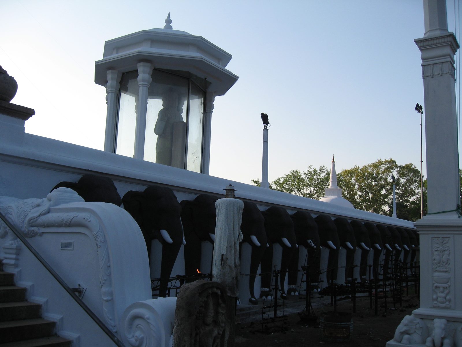 Cool painted elephant heads forming a perimeter around the stupa.