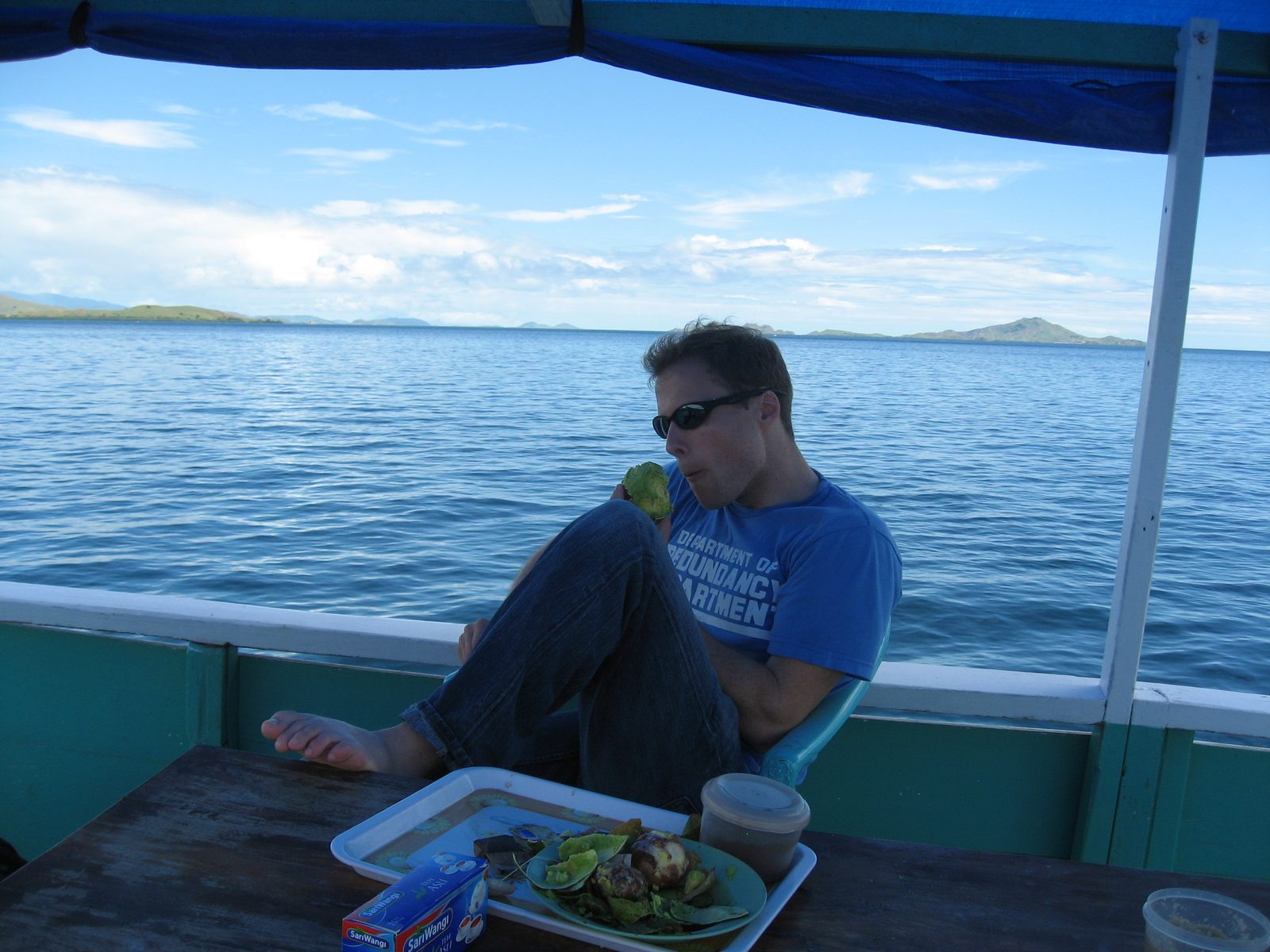 John eating an avocado aboard the S.S. Cockroach.