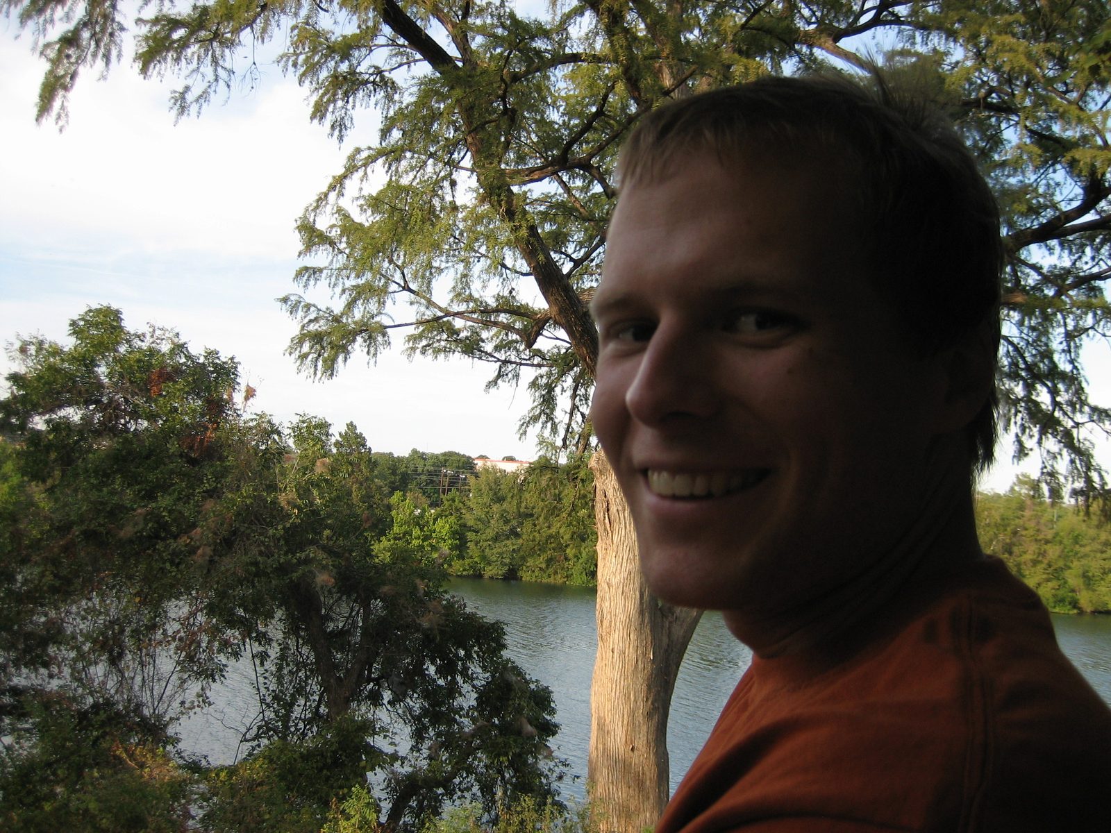 John on the train, with Town Lake in the background.