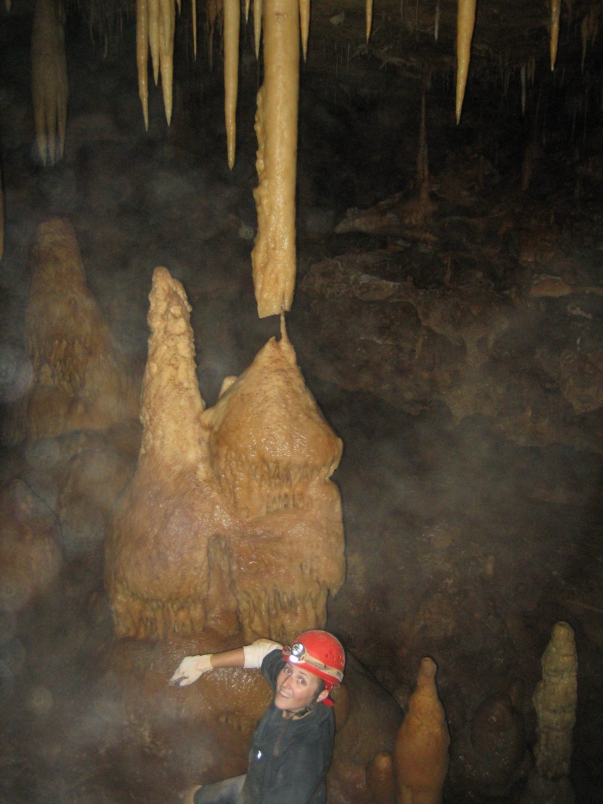 That stalactite and stalagmite are actually noooot quiiiite touching.  Very close, though (maybe...