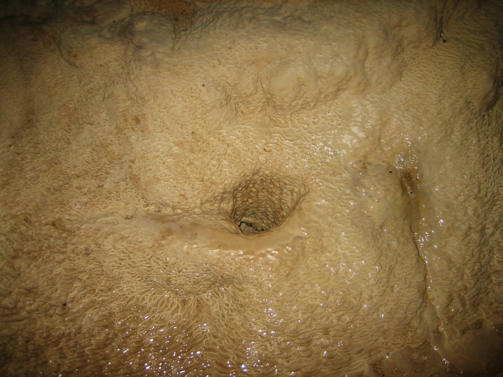 Where the drill hit on cave floor.