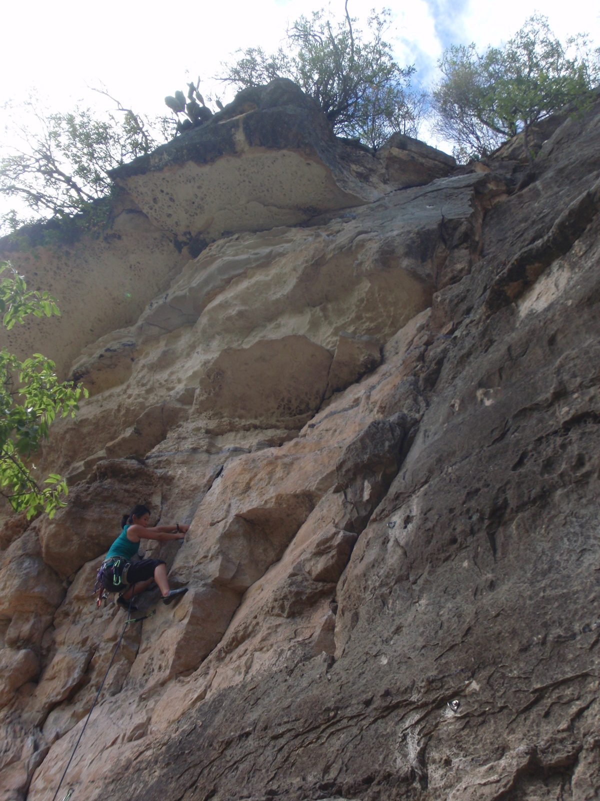 Monica trying her hand on the sharp end of the rope on some 5.9 or or 5.10- climb in the Barton...