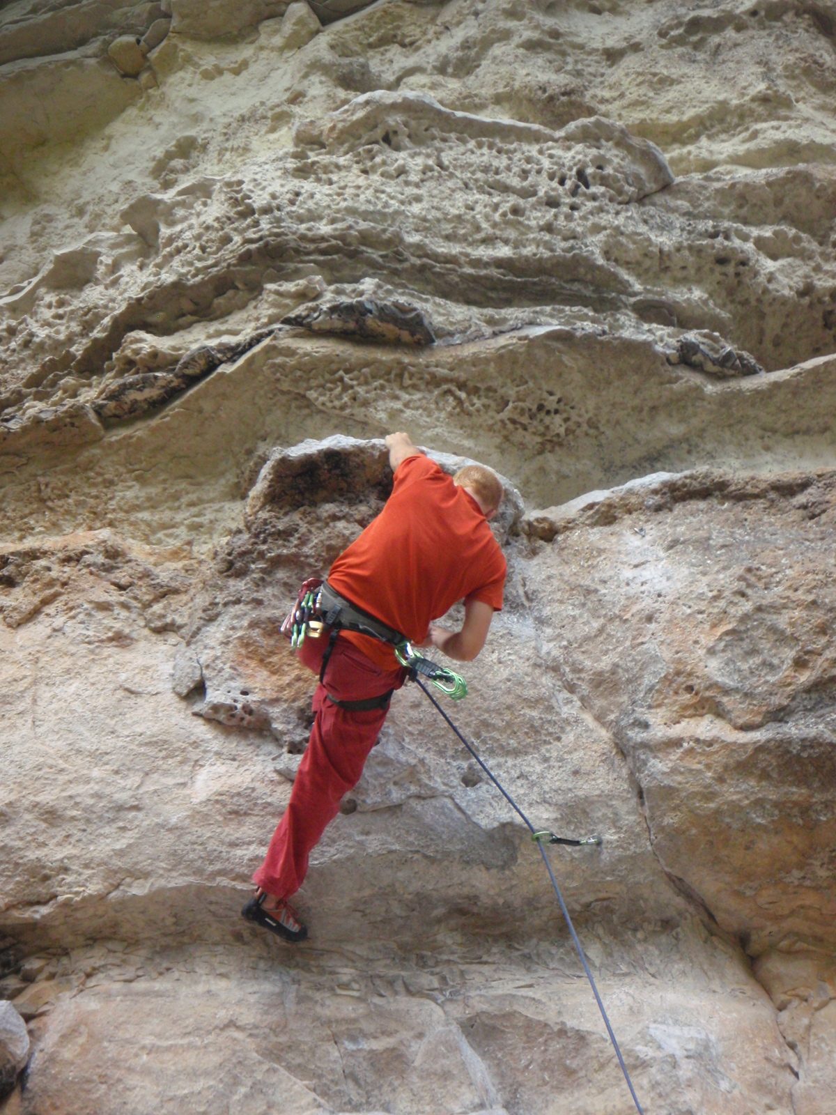 John, on about the 10th try, manages to grab the ledge and hold on.