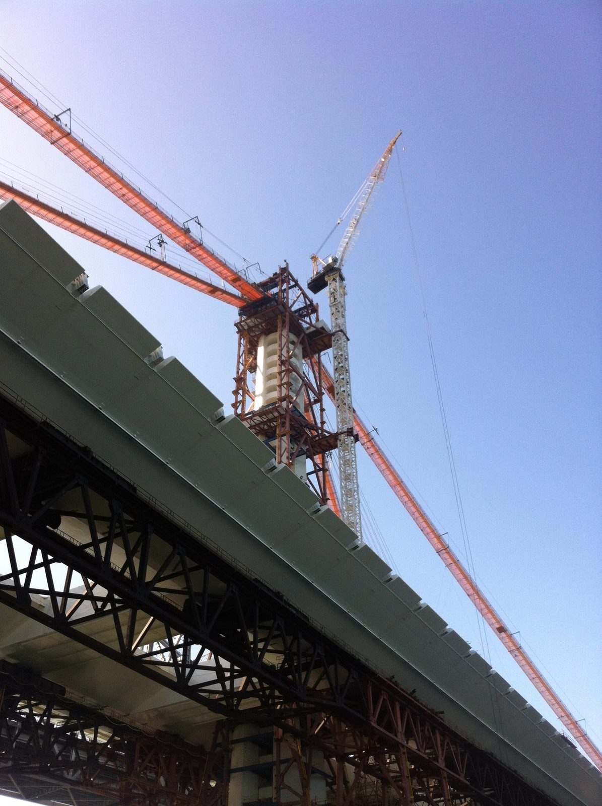 Looking up at the Bay Bridge tower and crane.