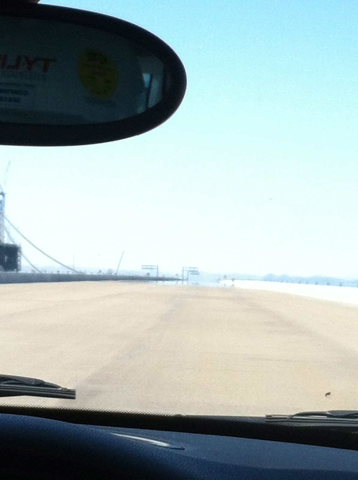 Seeing a mirage on the nearly complete skyway, headed west. Taken from Carol's Mini Cooper.