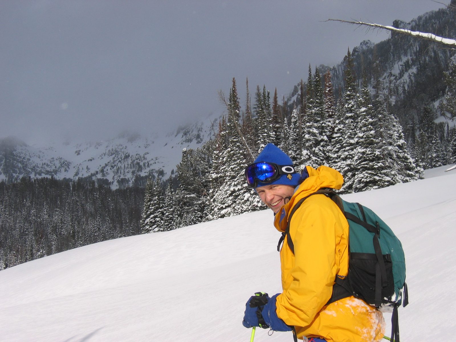 John, with a storm looming in the distance near Beehive Peak.