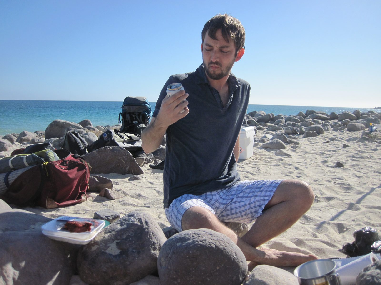 Jon does not look very excited about his breakfast beer. 