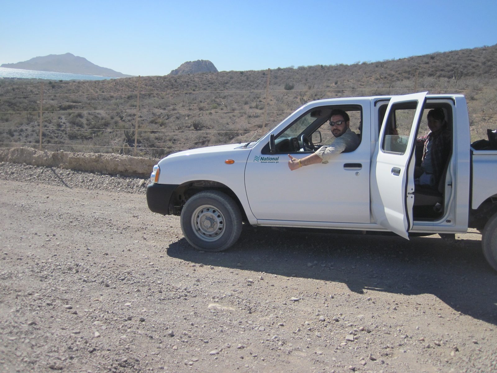 Jasper, piloting our noble steed south down the east coast of Baja. Bahia de Frailes ahead.
