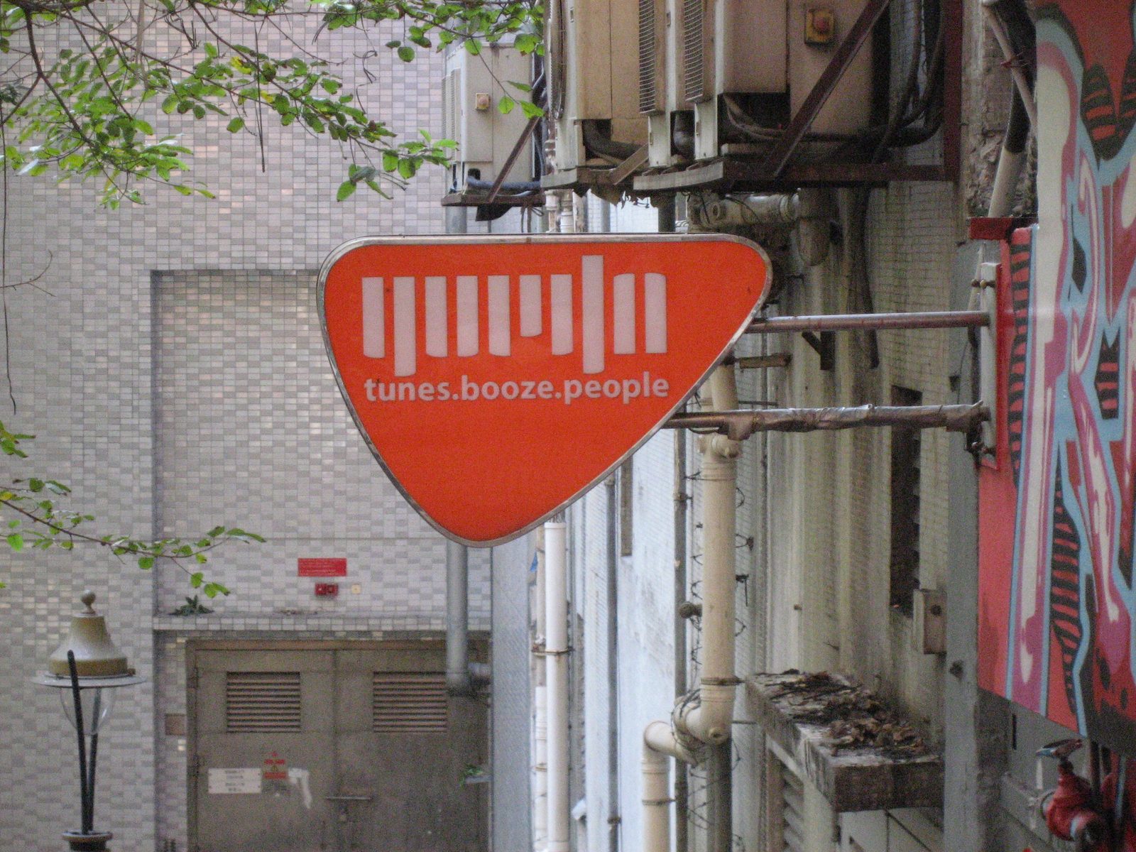 Sign for a bar somewhere in Mid-Levels.  Doesn't leave much to the imagination.