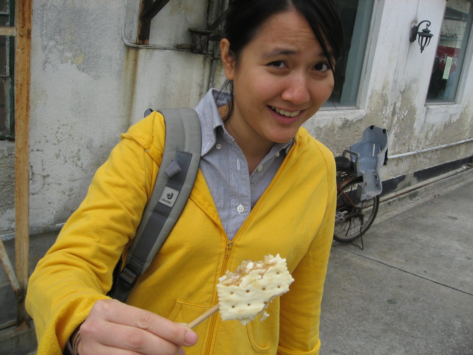 Min Li looks a bit skeptical about the malt-on-a-stick wedged between two saltines that we just...