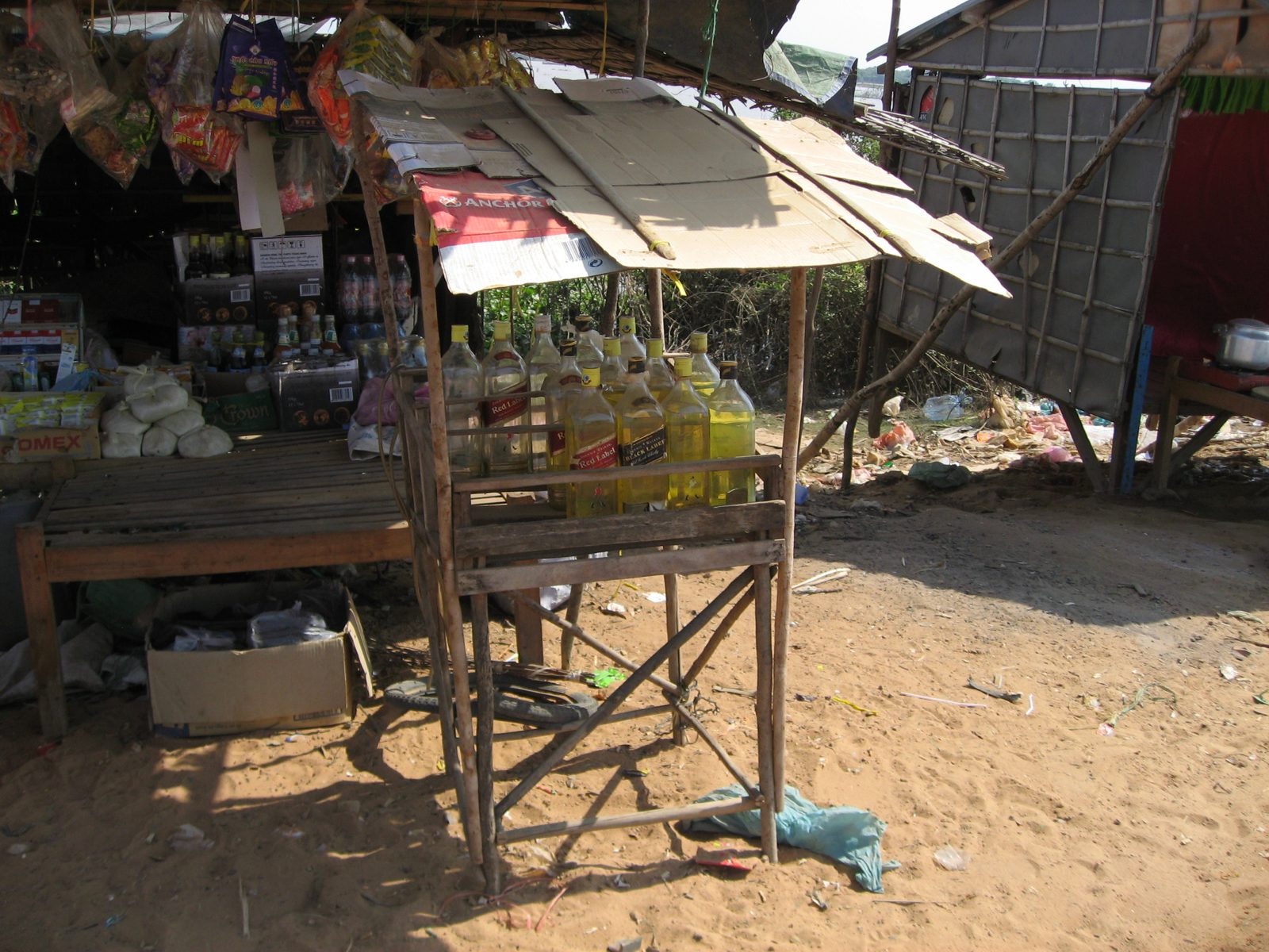 Cambodian gas station:  1 liter of gasoline costs $1 US, and is dispensed from a Johnnie Walker...