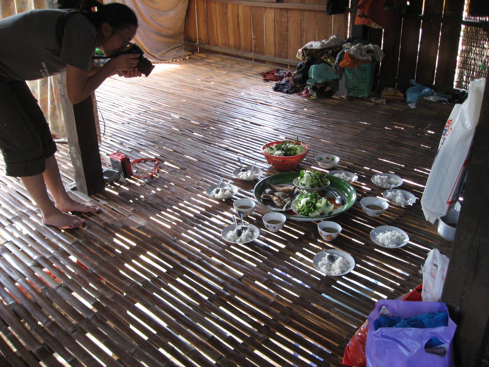 Helena photographs the beautiful lunch prepared by our host family: sauteed whole fish, cabbage,...