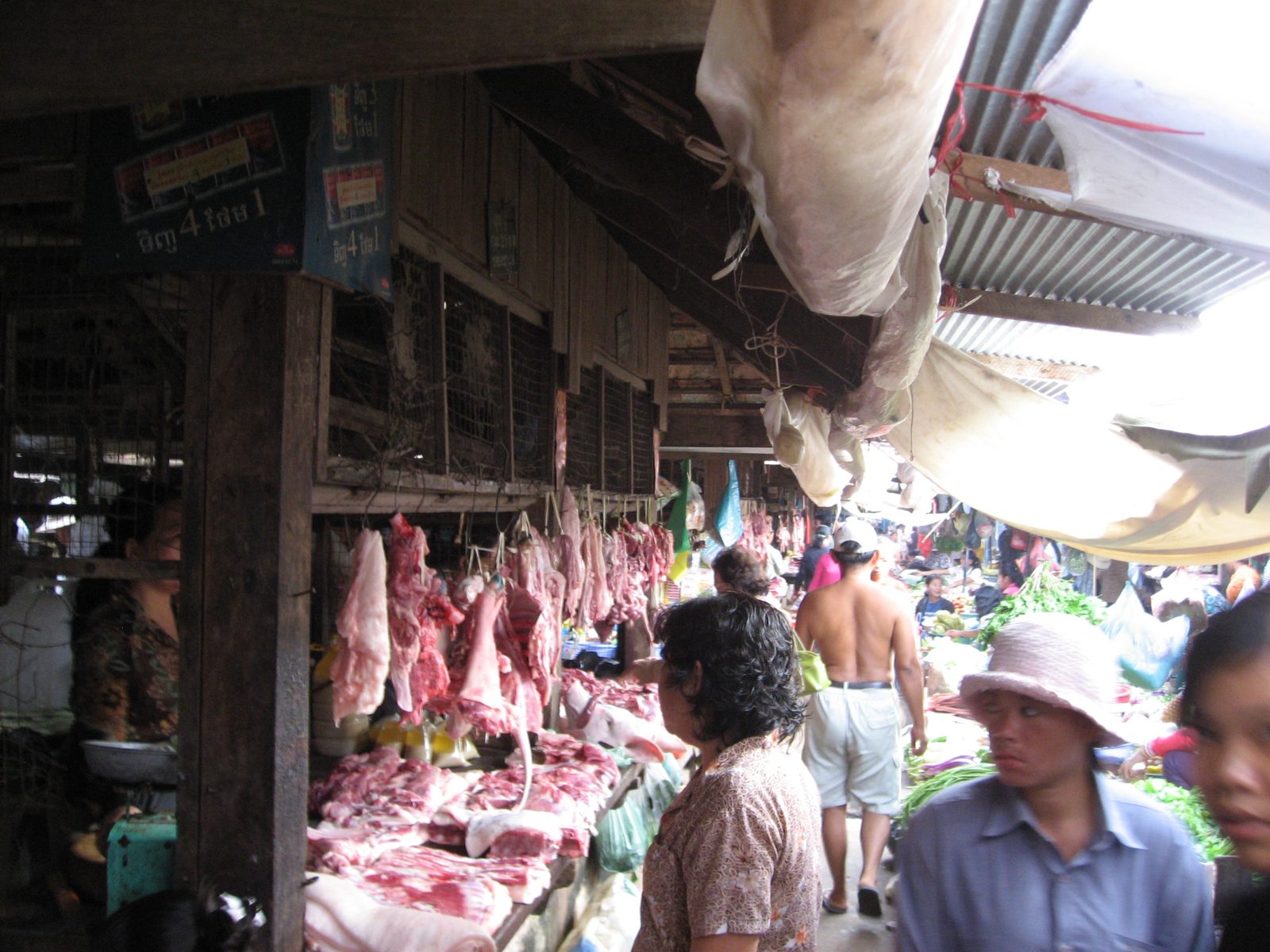 Various animal parts for sale at the Kampot Market.  Bonus points for spotting the pig's head.