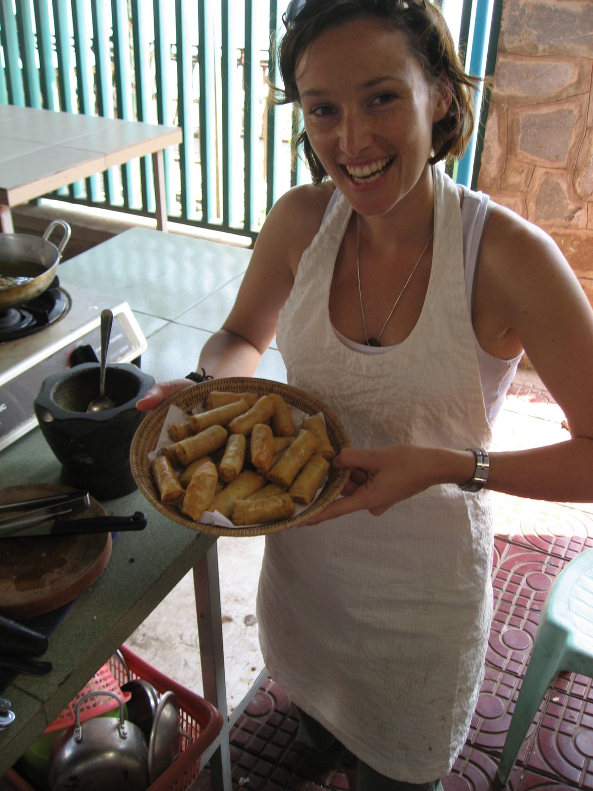 Louise shows off our creation: crispy spring rolls made with taro, carrot, and wrapped in potato...
