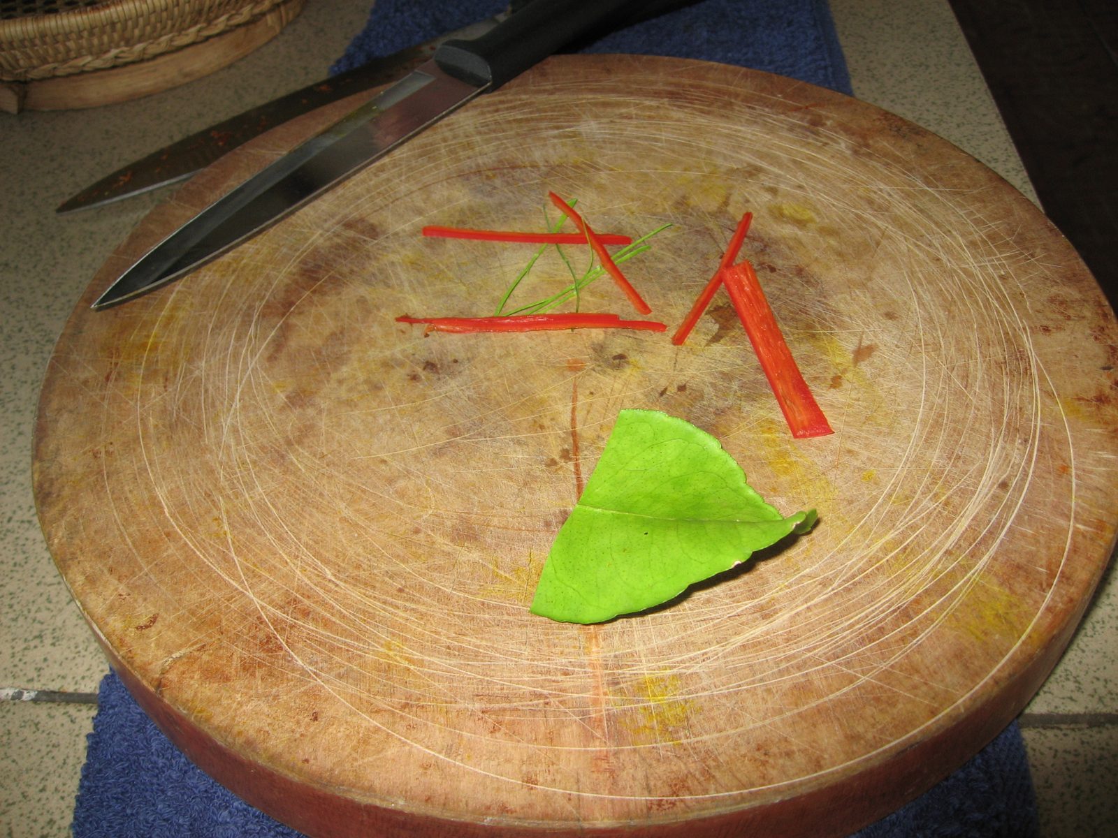 Garnish for fish amok:  very, very thinly cut slices of red chili and Kaffir lime leaf.