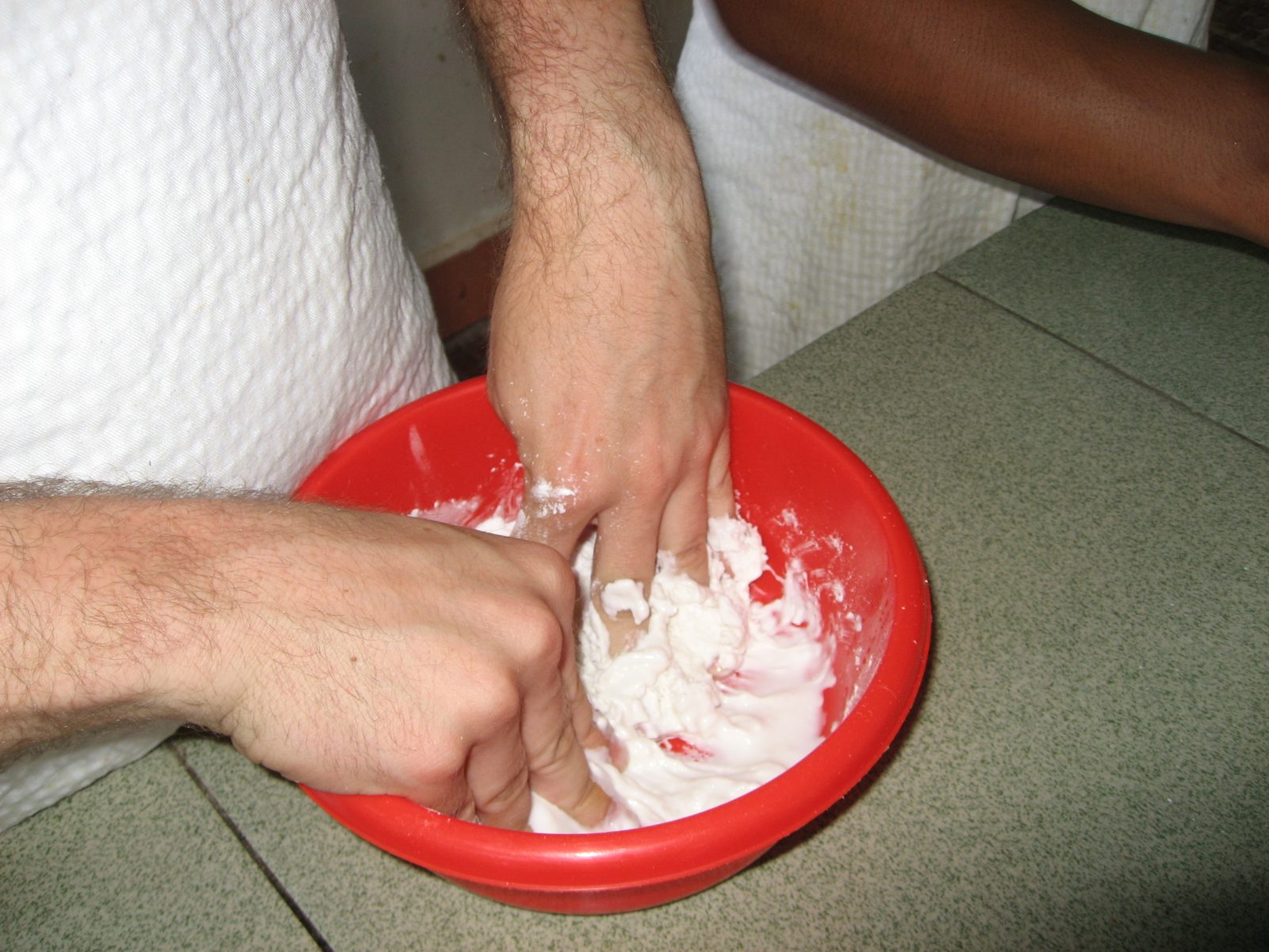 Kneading the glutenous rice flour and water into dough.