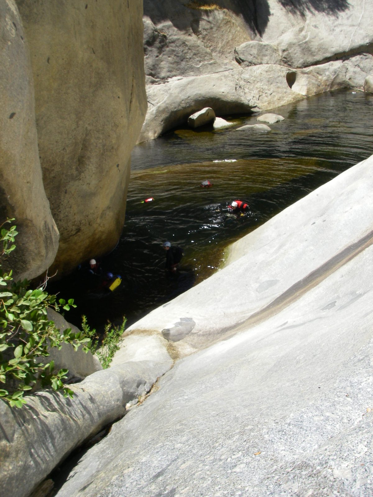 John, pushing his backpack along the river.  As it turns out, it's really hard to swim without...