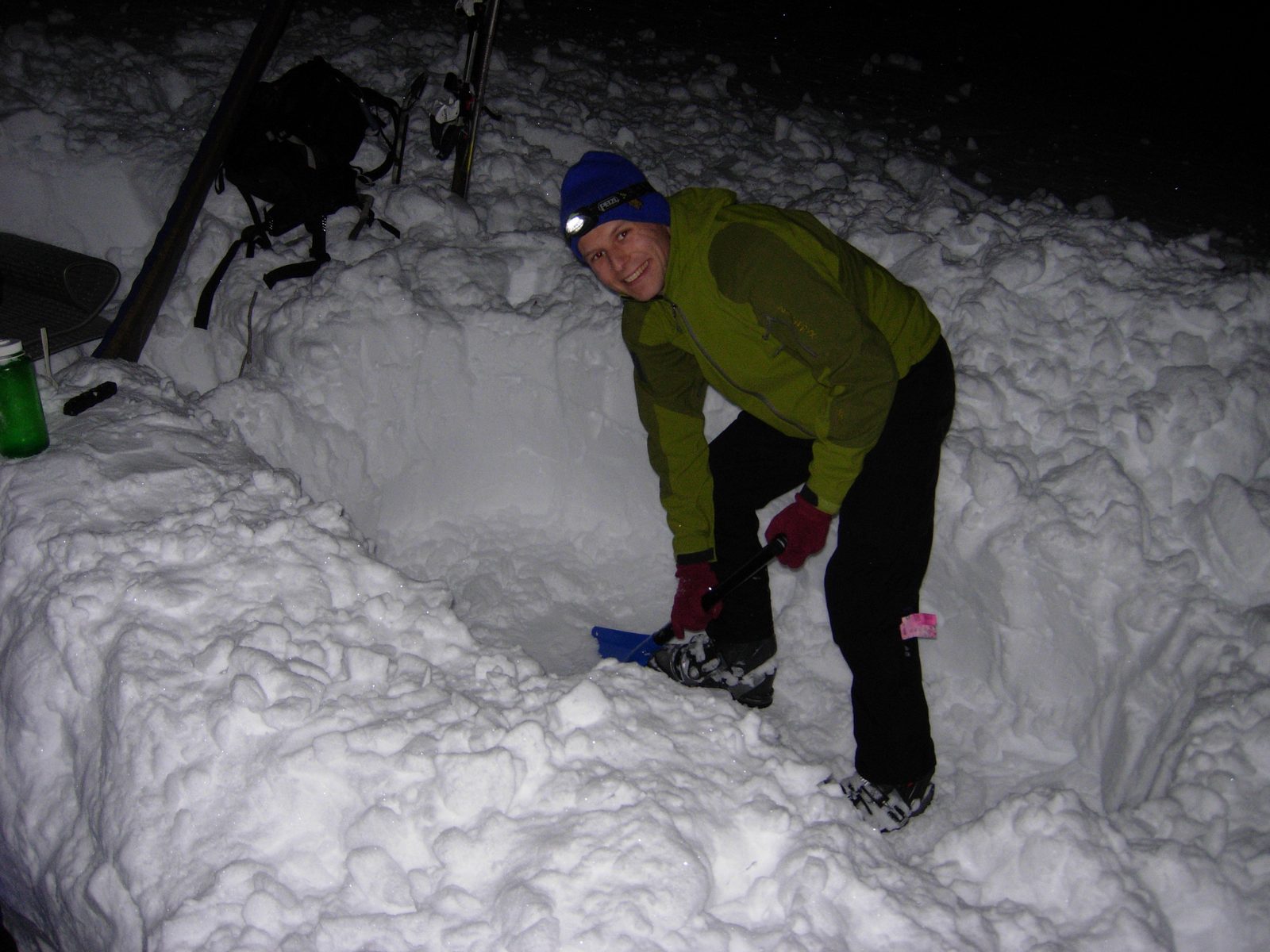 John, digging a sleeping pit.