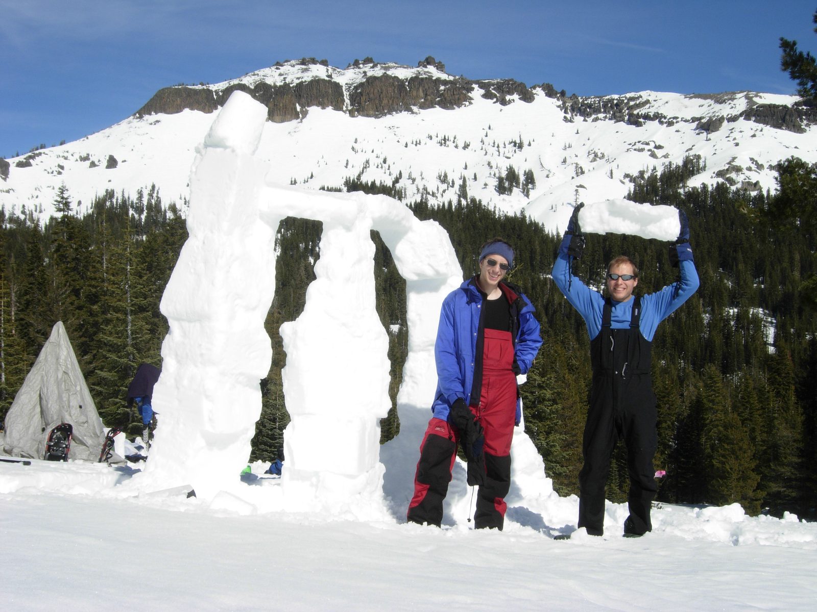 David and John with Snowhenge.  John holding a snow-brick.