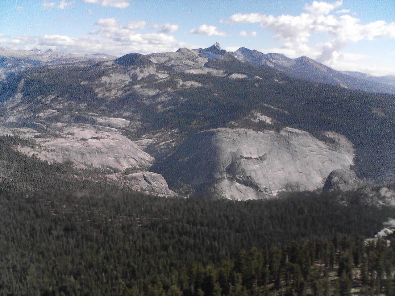 Little Yosemite Valley with very tall spired mountain in the background.
