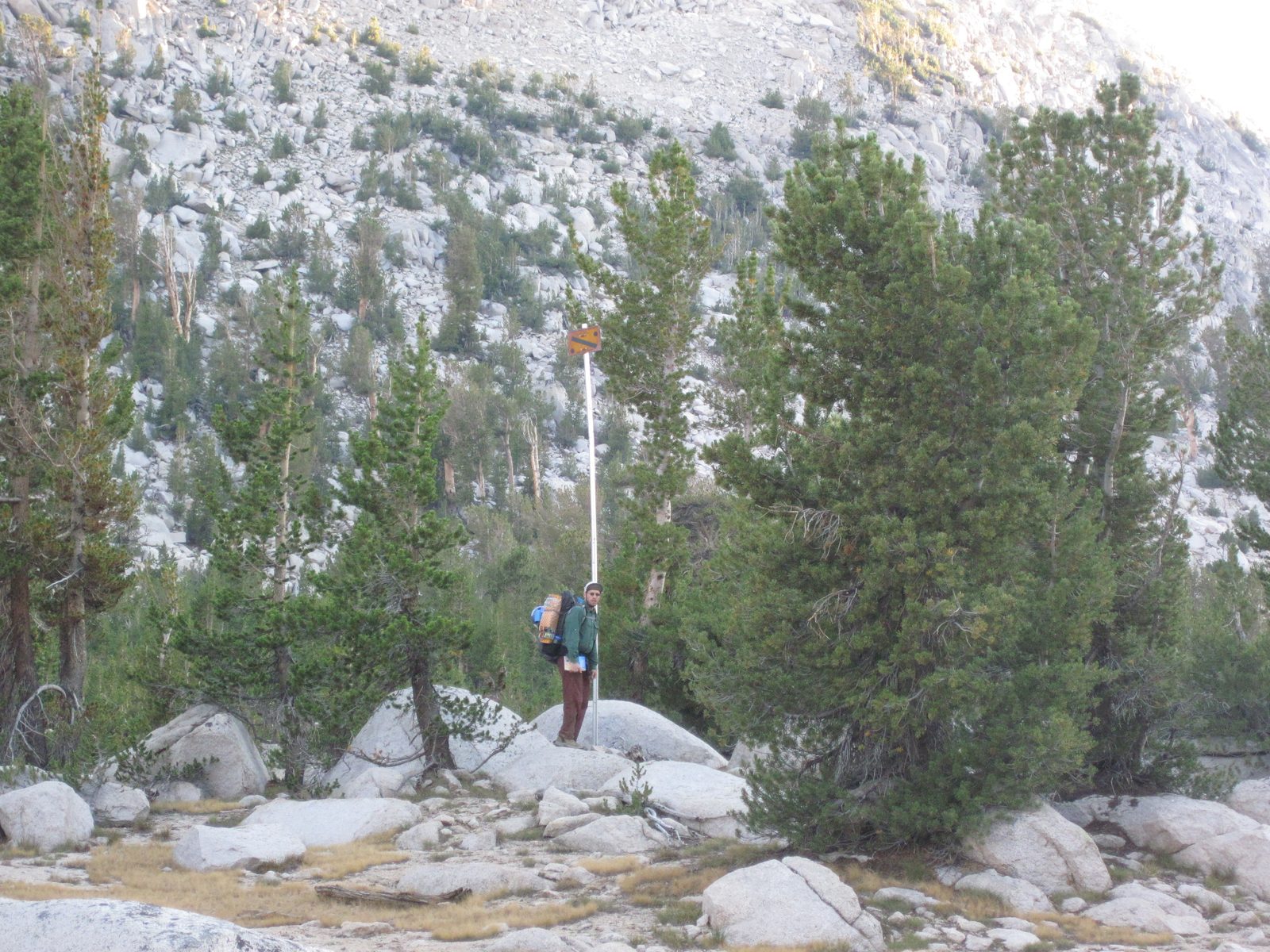 Joel finds a stake used by the Los Angeles Water Commission for snow accumulation measurement.