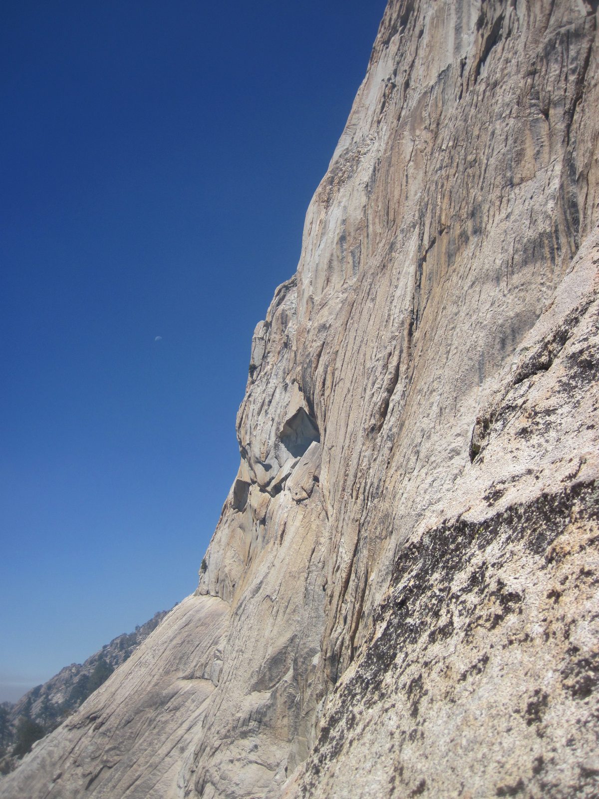View of the rather difficult face to the left / west of our climbing route. Moon also visible,...