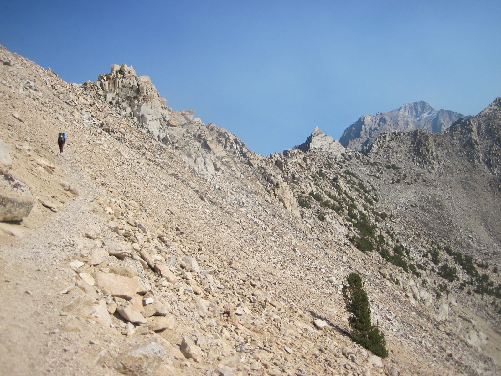 Joel takes off for the pass while I limp along. See the triangular peak from a few shots ago?...