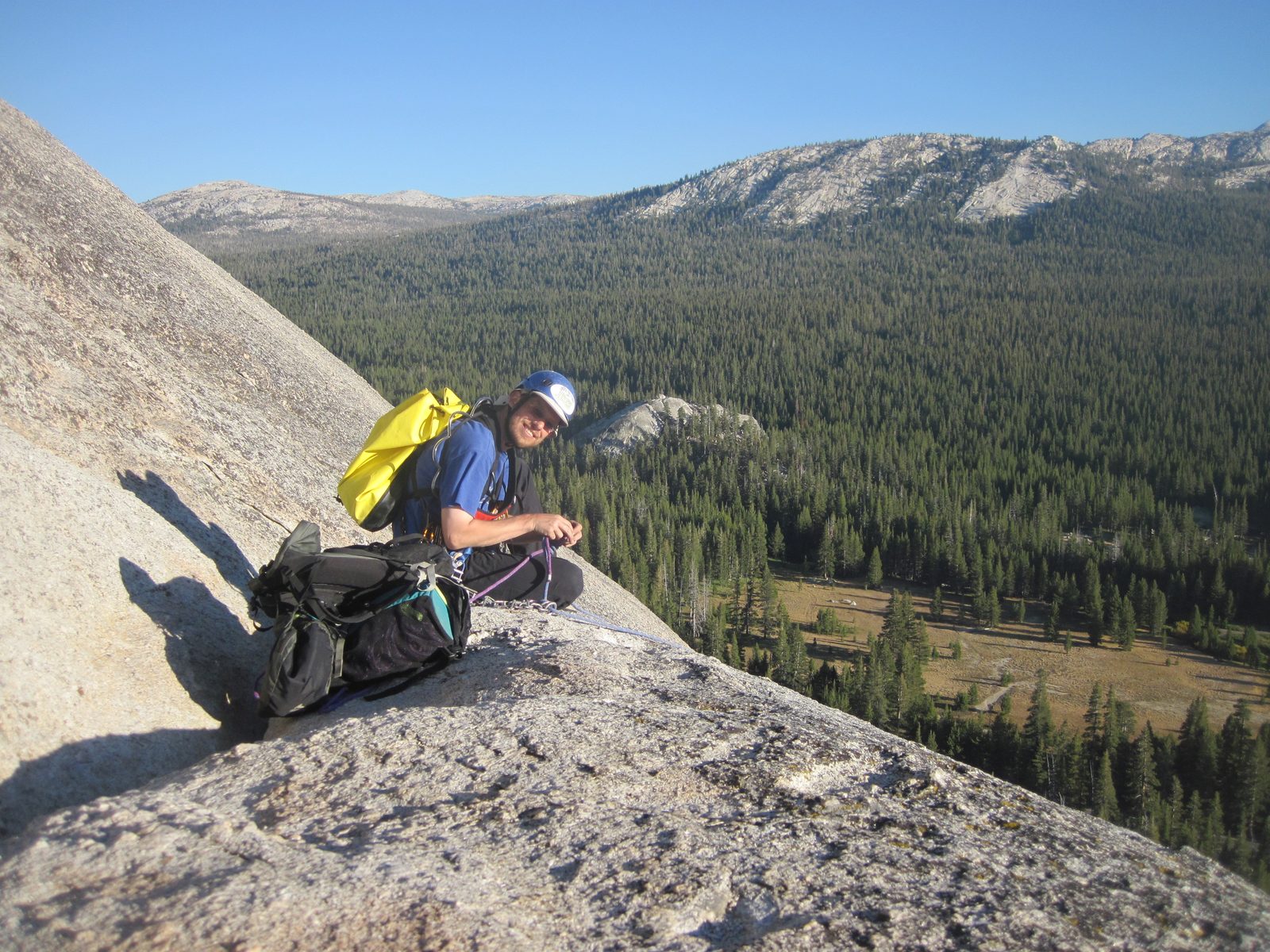 Joel, rigging our rappel from the anchor at the top of the Water Streak climbs on the front of...