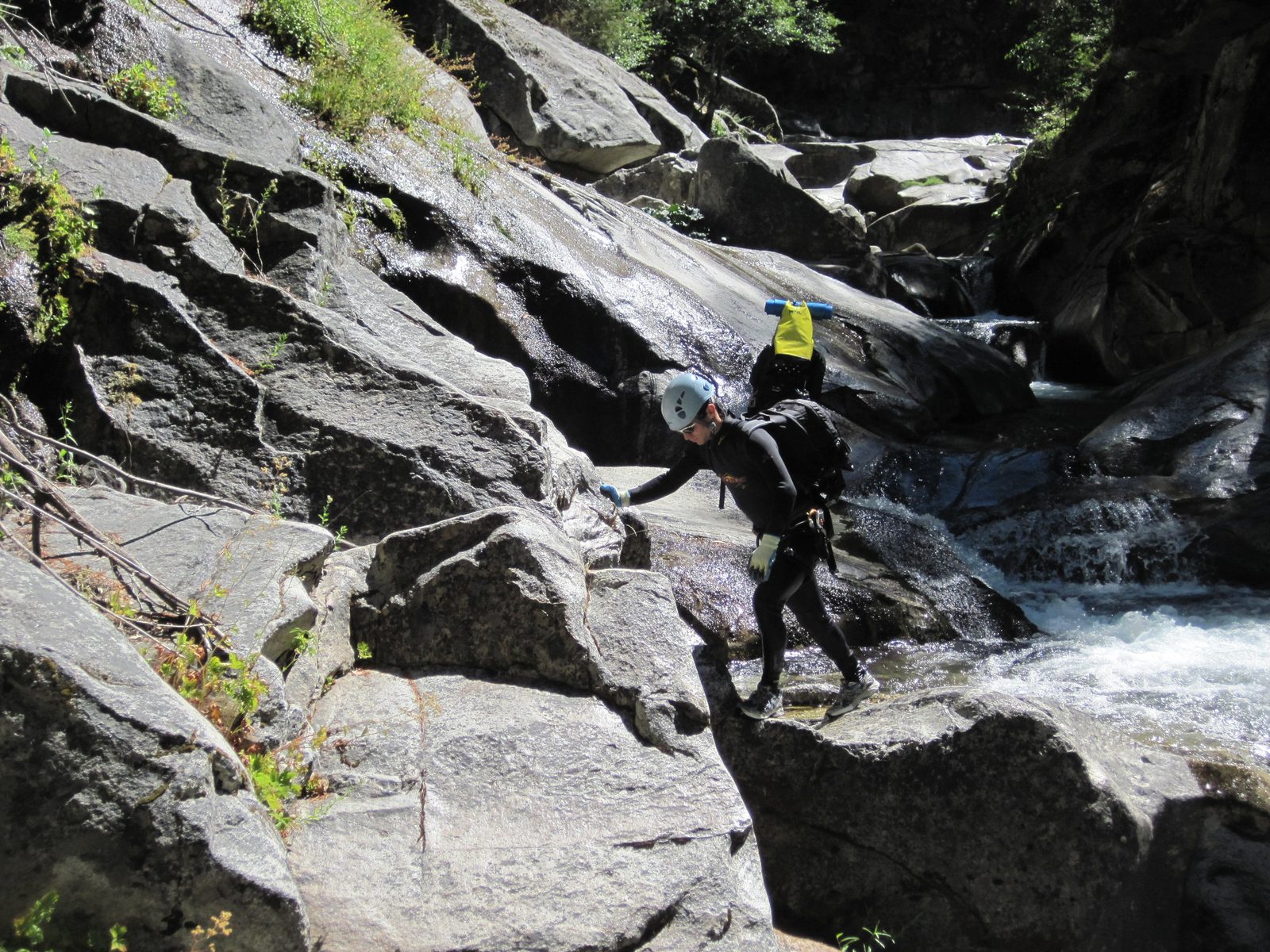 Vinnie, navigating down over some slippery rocks.
