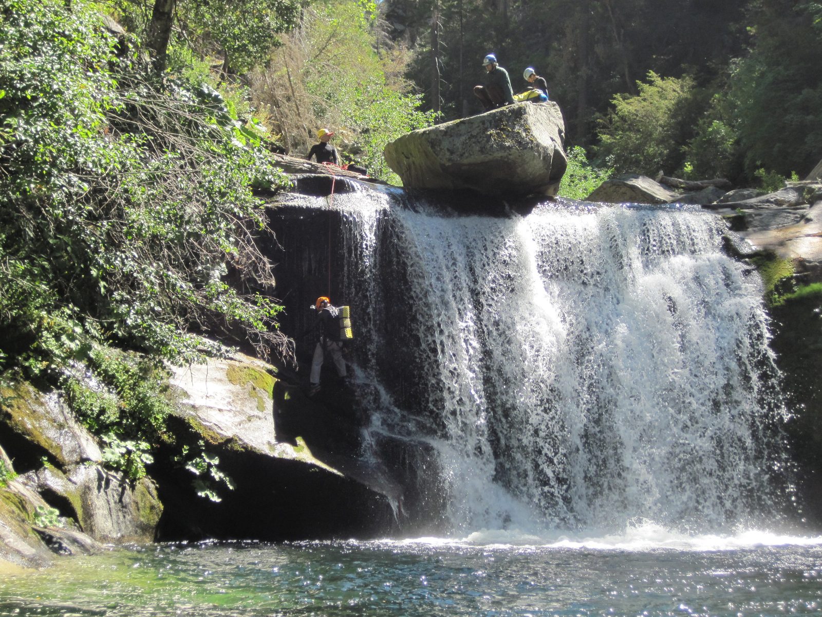 Yang rappels down.