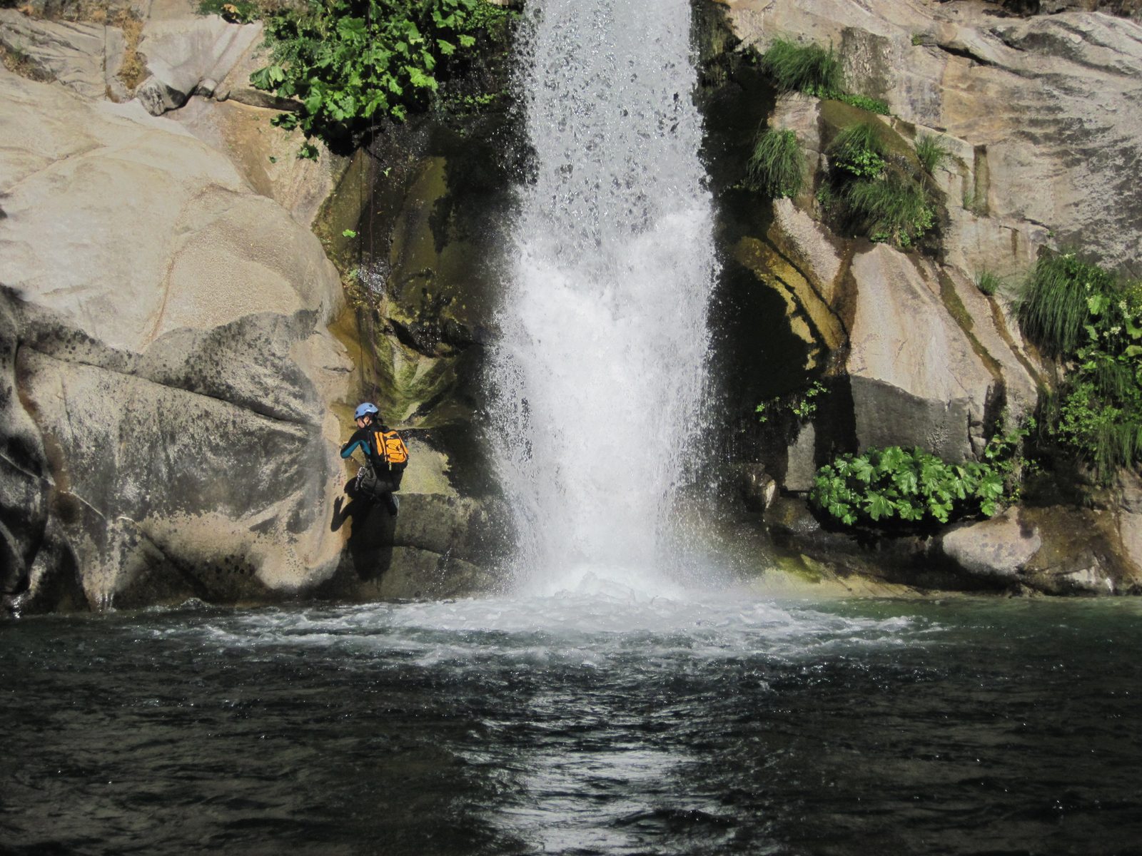 Monica, rappelling next to the falls.