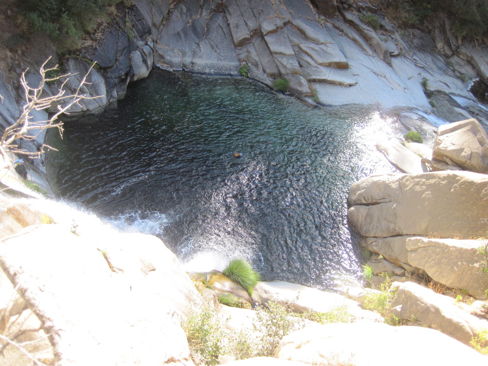 Our mystery photographer, looking over the abyss, at Monica splashing into the water.