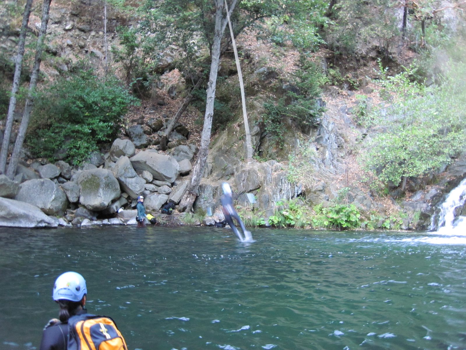 Vinnie jumping off a rope swing.