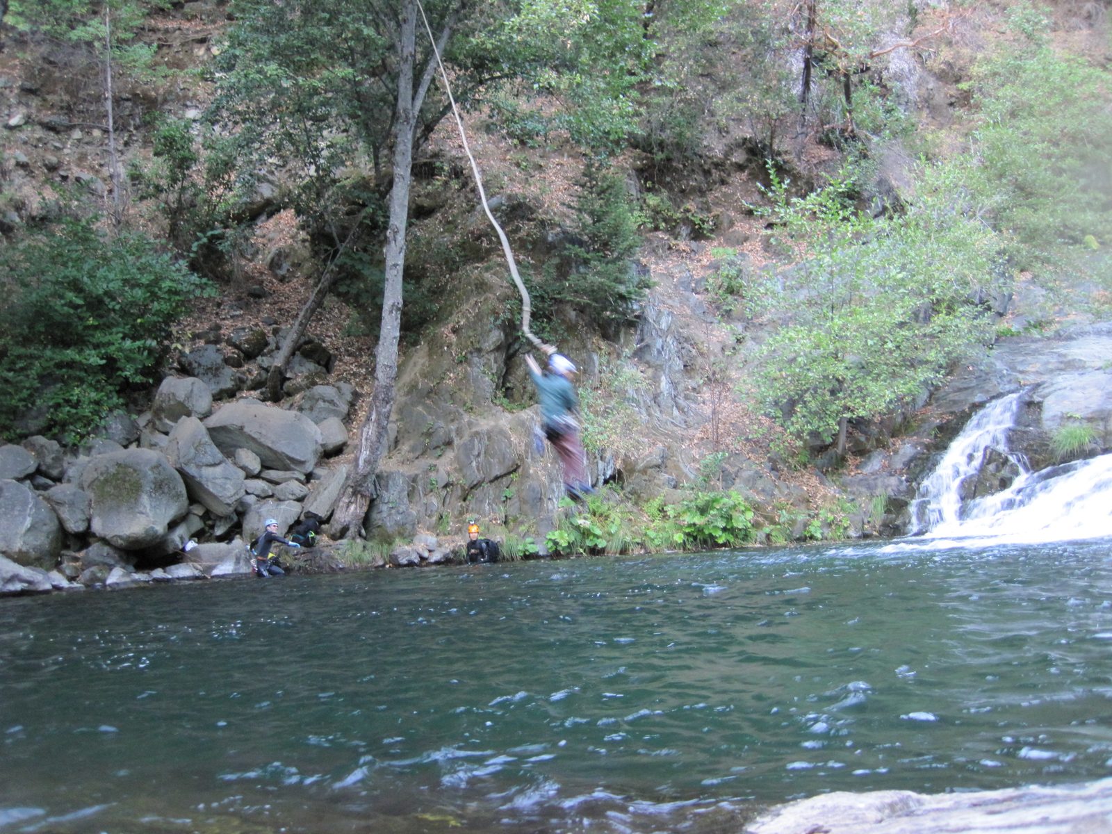 Joel swinging off the rope swing.