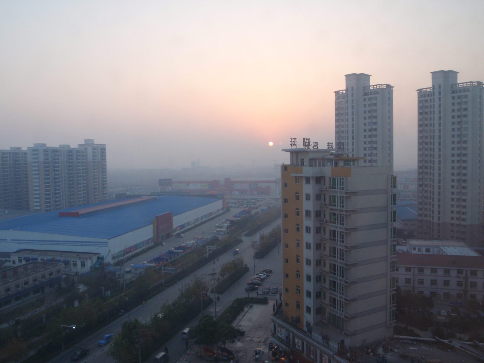 Sun just starts to become visible through the smog. One day, it was actually clear and I saw a...