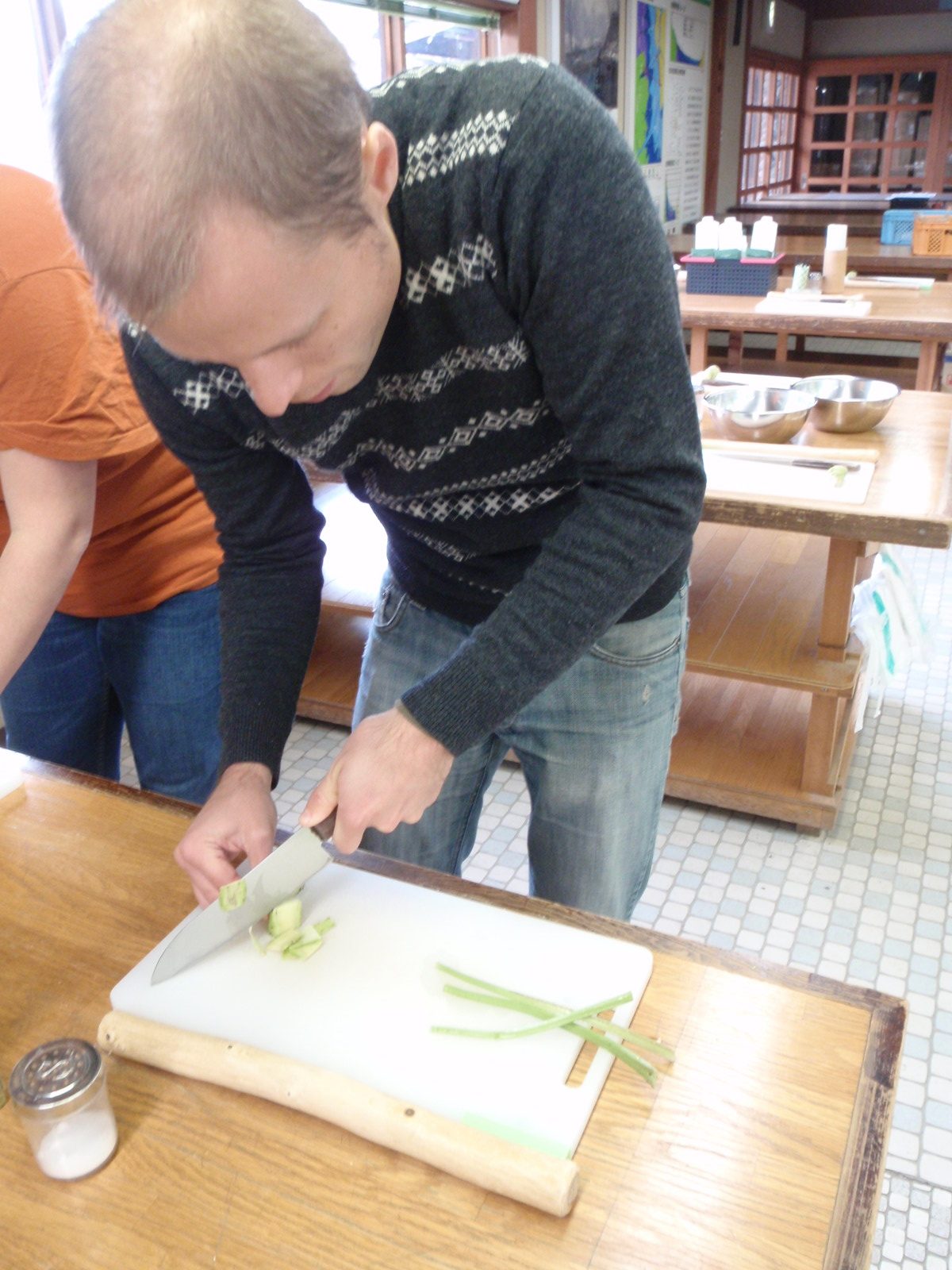 John, slicing some wasabi root.