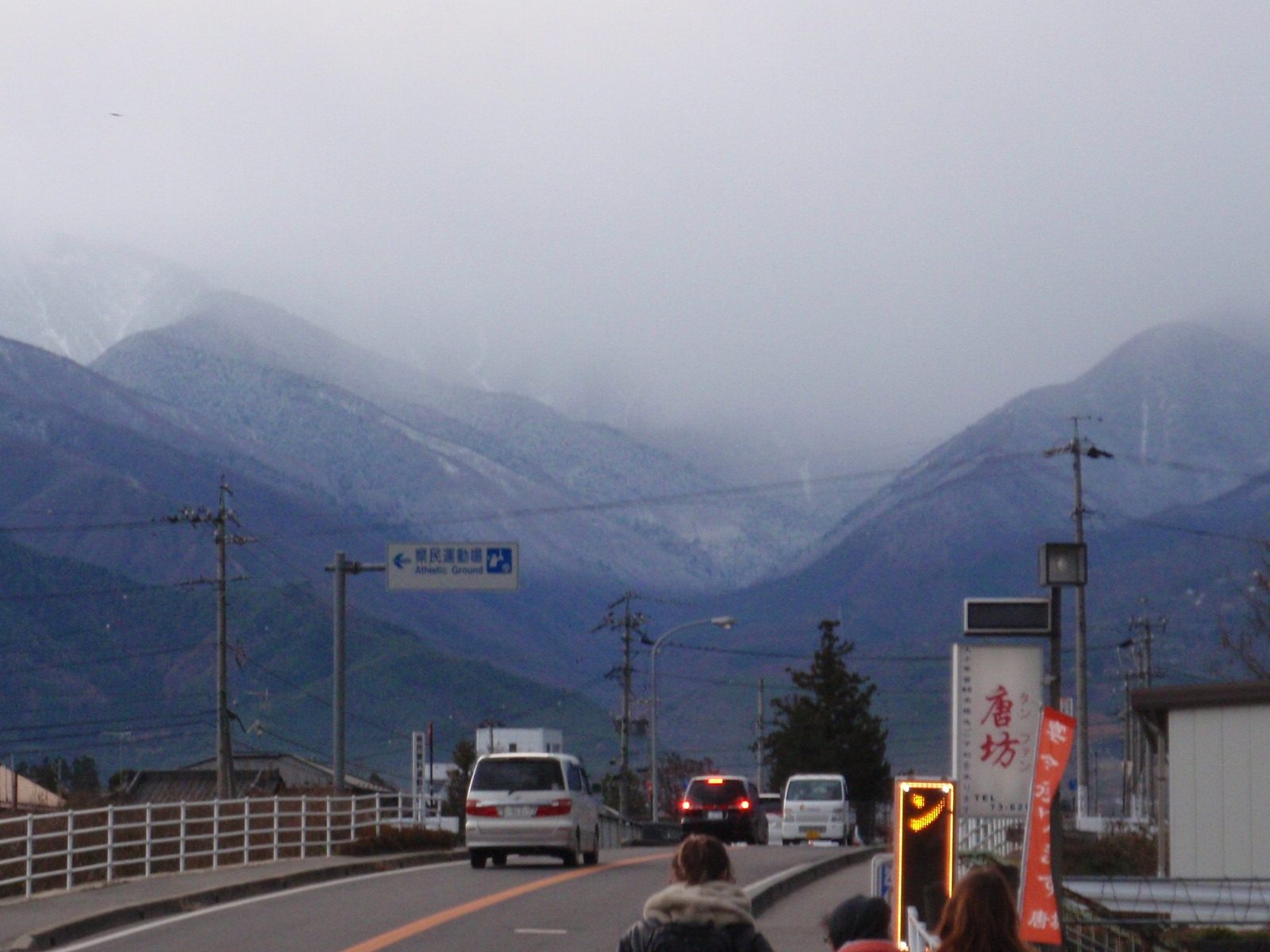 While we were inside the glass blowing studio, it started snowing and the mountains turned white.