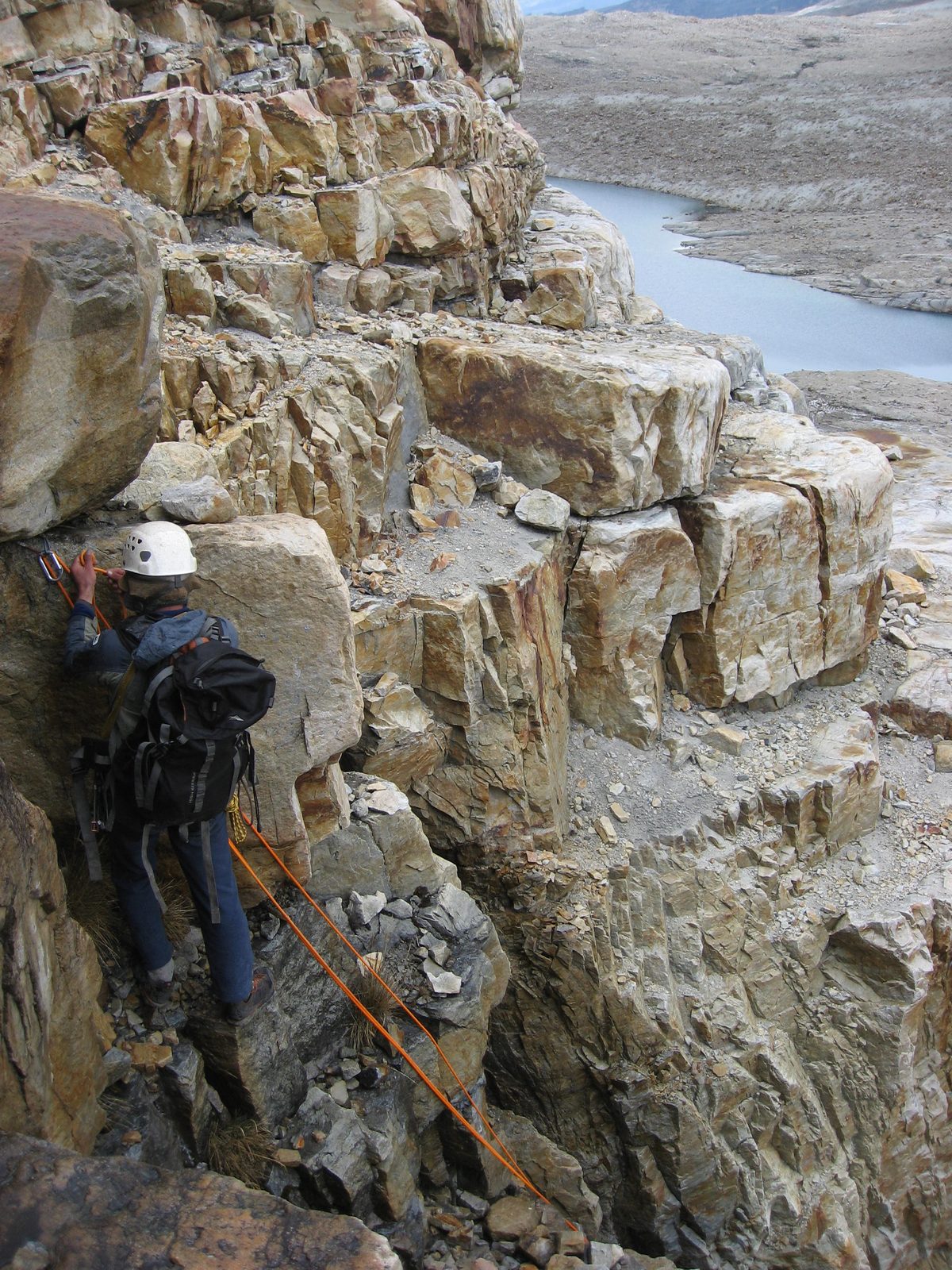 Rodrigo setting up a rope to rappel off the cliff.  More specifically, setting up my rope, on...