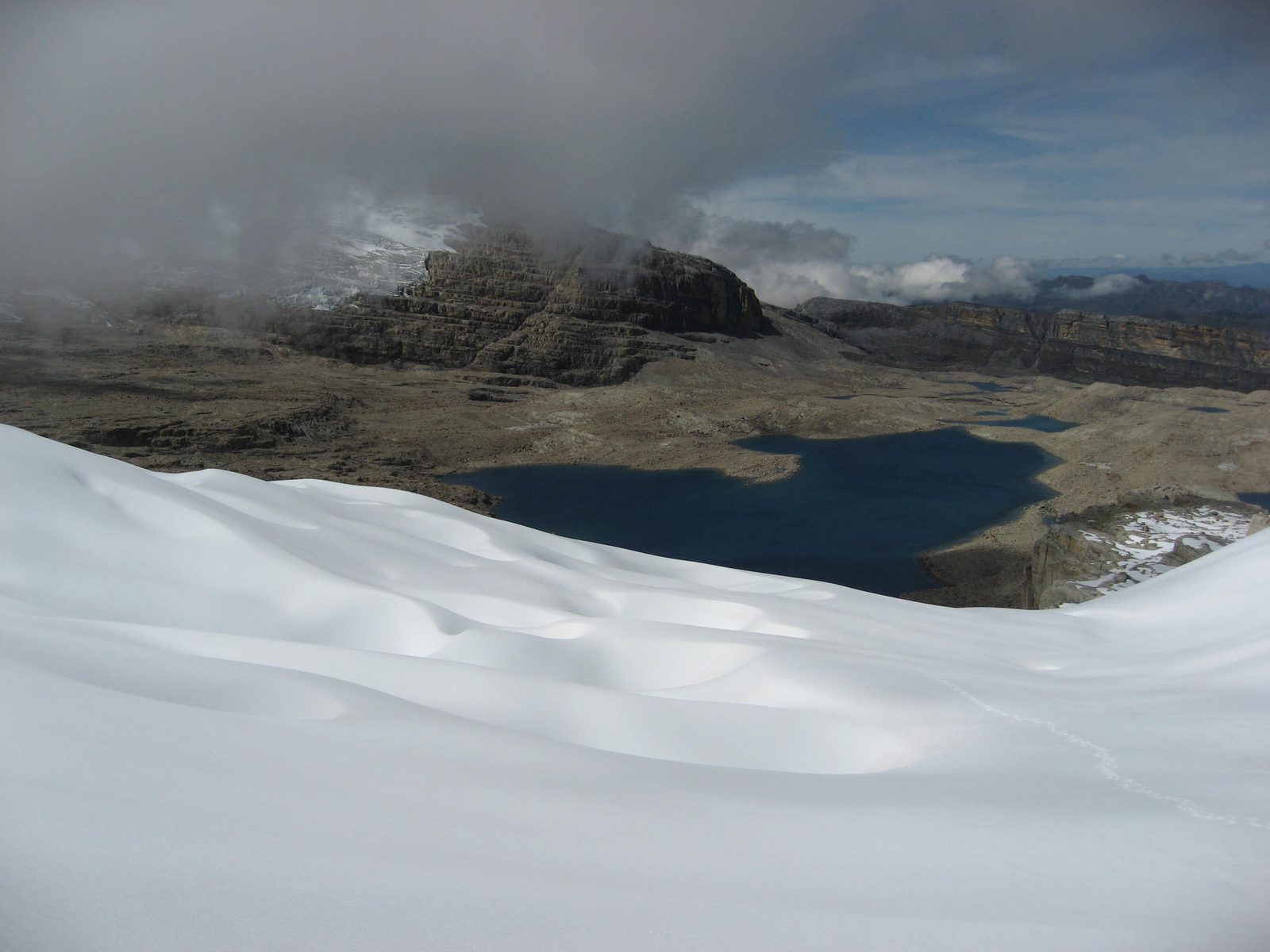 Looking back down the glacier at Laguna Granda and our campsite (the tiny lighter patch near the...
