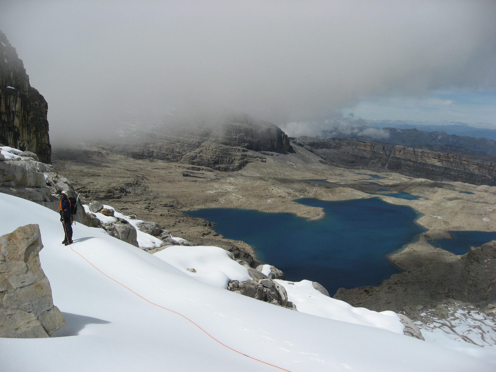 Rodrigo inspects where to climb.