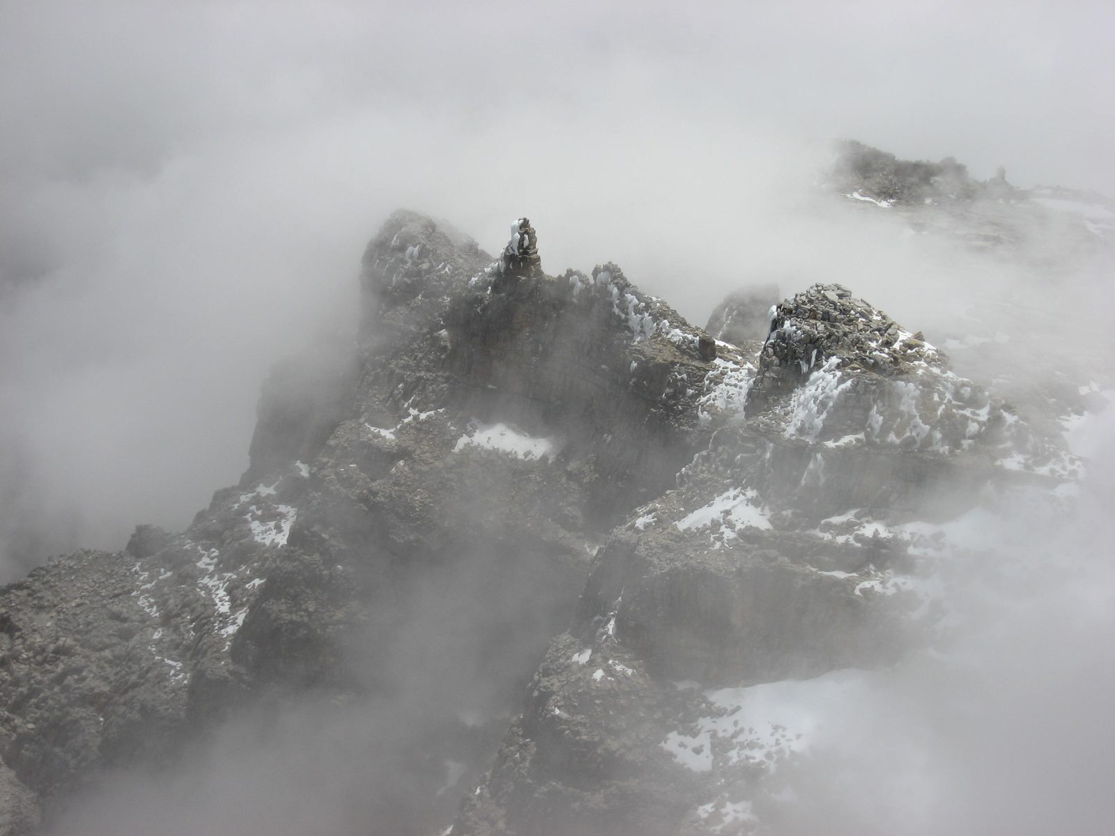 The ridge continued south, getting narrower and shaper all the way.  I'm glad the summit was...