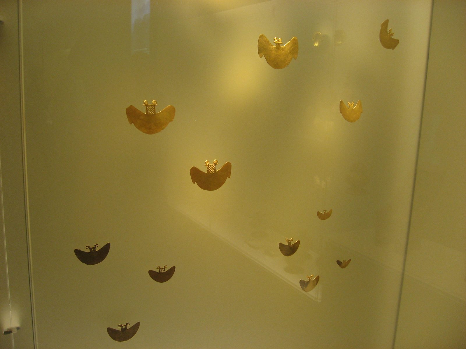 Gold nose rings that were made to look like bats.  Apparently the shaman took on the form of a...