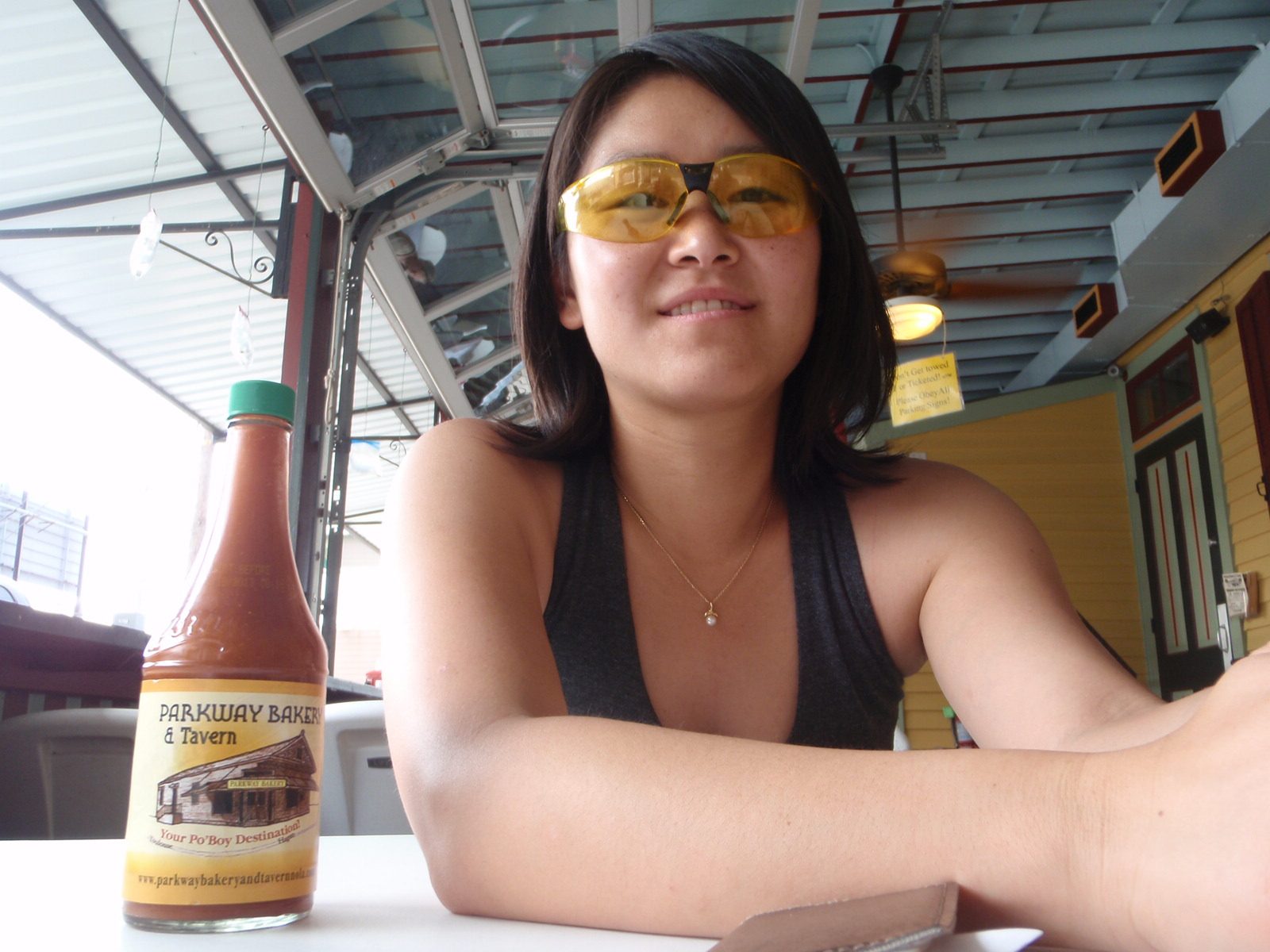 Monica tries on the sweet shades I bought at a market in Costa Rica for a dollar.