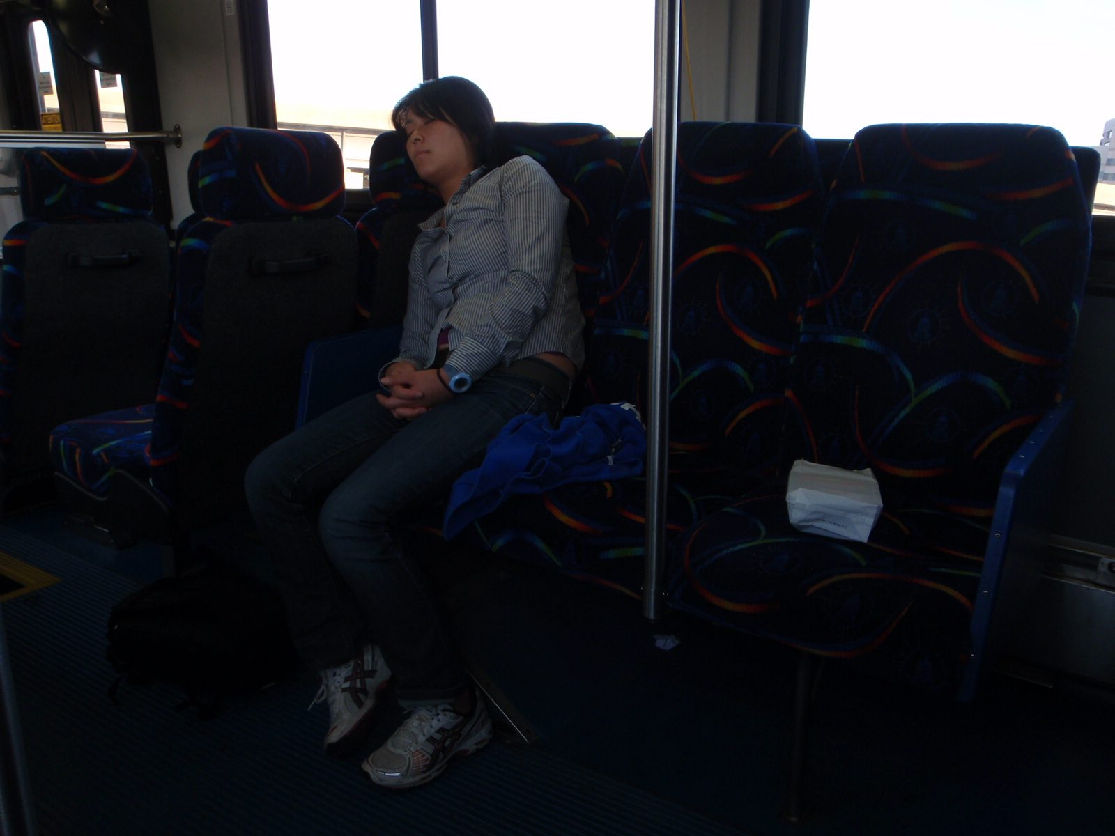 Monica sleeps on the bus.